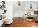 Bright living room featuring hardwood floors, modern light fixtures and a comfortable seating area at 6120 Payne Stewart Dr, Windermere, FL 34786
