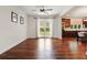 Bright and open living room with hardwood floors and views to the backyard at 6120 Payne Stewart Dr, Windermere, FL 34786