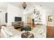 Open living room with a high ceiling, hardwood floors, and stylish furnishings at 6120 Payne Stewart Dr, Windermere, FL 34786