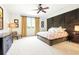 Cozy main bedroom features a ceiling fan, neutral tones, and natural light at 6120 Payne Stewart Dr, Windermere, FL 34786