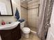 Tiled bathroom with shower, modern vanity, and fixtures at 655 Katherine Ave, Orlando, FL 32810