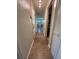 Hallway with wood flooring leading to the front door and views of the bathroom at 655 Katherine Ave, Orlando, FL 32810