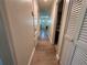 Hallway with wood flooring leading to the front door and views of the bathroom at 655 Katherine Ave, Orlando, FL 32810
