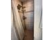 Shower with tile surround, shower caddy, and bronze fixtures at 655 Katherine Ave, Orlando, FL 32810