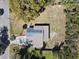 Overhead view of the property, showcasing the roof, layout, and the surrounding neighborhood with mature trees at 709 S Parsons Ave, Deland, FL 32720