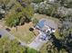 Aerial view of a well-maintained home, surrounded by lush trees and landscaping at 709 S Parsons Ave, Deland, FL 32720