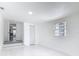 Finished basement area with light walls, new lighting, and an open floor plan at 709 S Parsons Ave, Deland, FL 32720