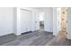Bright bedroom with modern floors, closet, and en suite bathroom at 709 S Parsons Ave, Deland, FL 32720