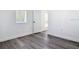 Bedroom with neutral walls, wood-look flooring, and modern trim at 709 S Parsons Ave, Deland, FL 32720