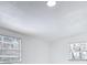 Bright bedroom featuring neutral walls, new windows with blinds, and modern lighting at 709 S Parsons Ave, Deland, FL 32720