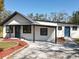 Stylish single-story home featuring two entry doors and a well-maintained front yard at 709 S Parsons Ave, Deland, FL 32720