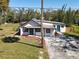 Stylish single-story home featuring two entry doors and a well-maintained front yard at 709 S Parsons Ave, Deland, FL 32720