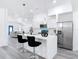Stylish kitchen featuring a central island with seating, stainless appliances, and an open floor plan at 709 S Parsons Ave, Deland, FL 32720