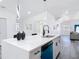 Bright kitchen with a large center island, modern fixtures, and a view into the living area at 709 S Parsons Ave, Deland, FL 32720