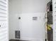Efficient laundry room includes a water heater and connections for a washer and dryer at 709 S Parsons Ave, Deland, FL 32720