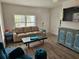 Relaxing living room with contemporary furniture and plenty of natural light at 723 Dougherty St, New Smyrna Beach, FL 32168