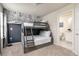 Charming bedroom with custom wallpaper mural and connected bathroom at 7376 Oakmoss Loop, Davenport, FL 33837