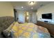 Large bedroom with carpet, good ceiling lighting, and dresser at 7609 Brookhurst Ln, Kissimmee, FL 34747