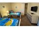 Bedroom featuring two twin beds with playful bedding, window, closet, and carpeted floor at 7609 Brookhurst Ln, Kissimmee, FL 34747