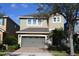 Charming two-story home with a two-car garage and well-maintained landscaping at 7609 Brookhurst Ln, Kissimmee, FL 34747