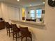 Kitchen with granite breakfast bar and island at 7609 Brookhurst Ln, Kissimmee, FL 34747