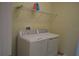 Modern laundry room with updated washer and dryer appliances at 7609 Brookhurst Ln, Kissimmee, FL 34747