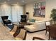 Spacious living room featuring lots of seating, a decorative rug, and natural light at 7609 Brookhurst Ln, Kissimmee, FL 34747
