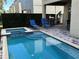 Relaxing backyard pool and patio area featuring a hot tub and lounge chairs at 7609 Brookhurst Ln, Kissimmee, FL 34747
