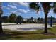 Community sand volleyball court with blue nets, offering a fun recreational space amid the neighborhood's landscape at 7609 Brookhurst Ln, Kissimmee, FL 34747