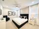 Serene bedroom with neutral tones, elegant furnishings, and ample natural light creating a relaxing atmosphere at 7719 Graben St, Kissimmee, FL 34747