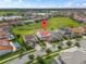 Stunning aerial view of the property surrounded by well-maintained lawns and neighboring homes at 8025 Topsail Pl, Winter Garden, FL 34787