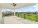 Large covered balcony with black metal railings and stunning views of the surrounding community at 8025 Topsail Pl, Winter Garden, FL 34787