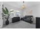 Bedroom with dark furniture, an area rug, lots of natural light, and a plant at 8025 Topsail Pl, Winter Garden, FL 34787