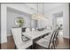 Bright dining area features a modern chandelier and seating for six people at 8025 Topsail Pl, Winter Garden, FL 34787