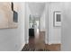 Elegant hallway features hardwood floors and sophisticated decor at 8025 Topsail Pl, Winter Garden, FL 34787