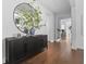 Hallway with a dark wood console table and a circular mirror, creating an inviting space at 8025 Topsail Pl, Winter Garden, FL 34787