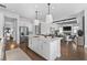 Bright kitchen with stainless steel appliances and a large center island at 8025 Topsail Pl, Winter Garden, FL 34787