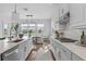 Modern kitchen featuring white cabinets, stainless appliances, and an island at 8025 Topsail Pl, Winter Garden, FL 34787
