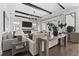Bright living room with dark wood floors and access to an outdoor patio at 8025 Topsail Pl, Winter Garden, FL 34787