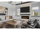 Comfortable living room features a stone fireplace and cozy seating arrangement at 8025 Topsail Pl, Winter Garden, FL 34787