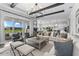 Open living area with large windows, ample seating, and stylish decor at 8025 Topsail Pl, Winter Garden, FL 34787