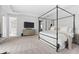 Large main bedroom with a cozy atmosphere, a decorative bed, and a glimpse into the en-suite bathroom at 8025 Topsail Pl, Winter Garden, FL 34787