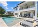 A private backyard with a pool, patio, and outdoor seating is great for entertaining at 8025 Topsail Pl, Winter Garden, FL 34787