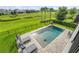 A backyard pool with chaise lounges and landscaping offers a serene outdoor retreat at 8025 Topsail Pl, Winter Garden, FL 34787