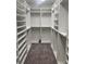 Spacious walk-in closet with custom shelving for optimal organization at 8025 Topsail Pl, Winter Garden, FL 34787