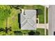 Aerial view of the home and backyard showcasing the lush landscaping and outdoor features at 824 Palm Cove Dr, Orlando, FL 32835