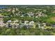 An aerial view highlights this home's location within a well-maintained neighborhood with mature trees at 824 Palm Cove Dr, Orlando, FL 32835