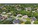 Aerial view of home with red pin showing its location in a lush, green neighborhood at 824 Palm Cove Dr, Orlando, FL 32835