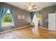 Bright, airy bedroom with hardwood floors, neutral walls, and large window at 824 Palm Cove Dr, Orlando, FL 32835