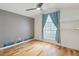 bedroom with light walls and accents, large windows and hardwood floors at 824 Palm Cove Dr, Orlando, FL 32835